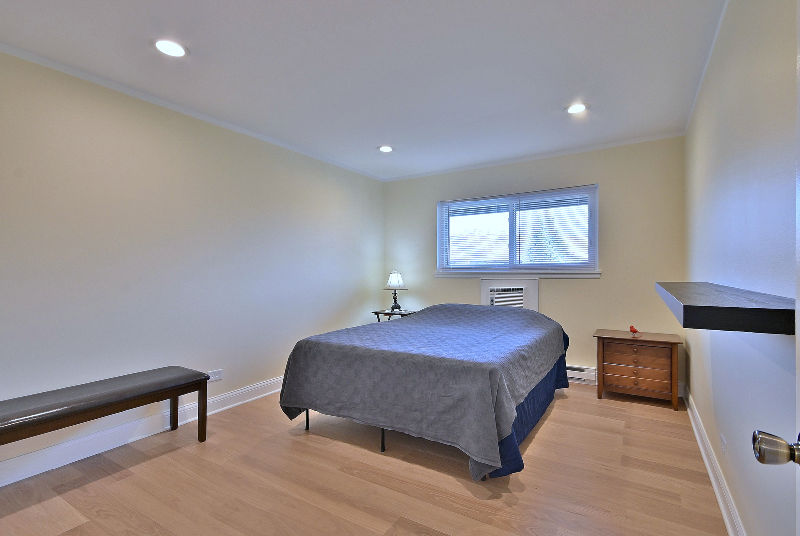 836 East Old Willow Road, Unit 211 Prospect Heights, IL 60070 - Photo 18 of 28 a bedroom with a bed and a night stand