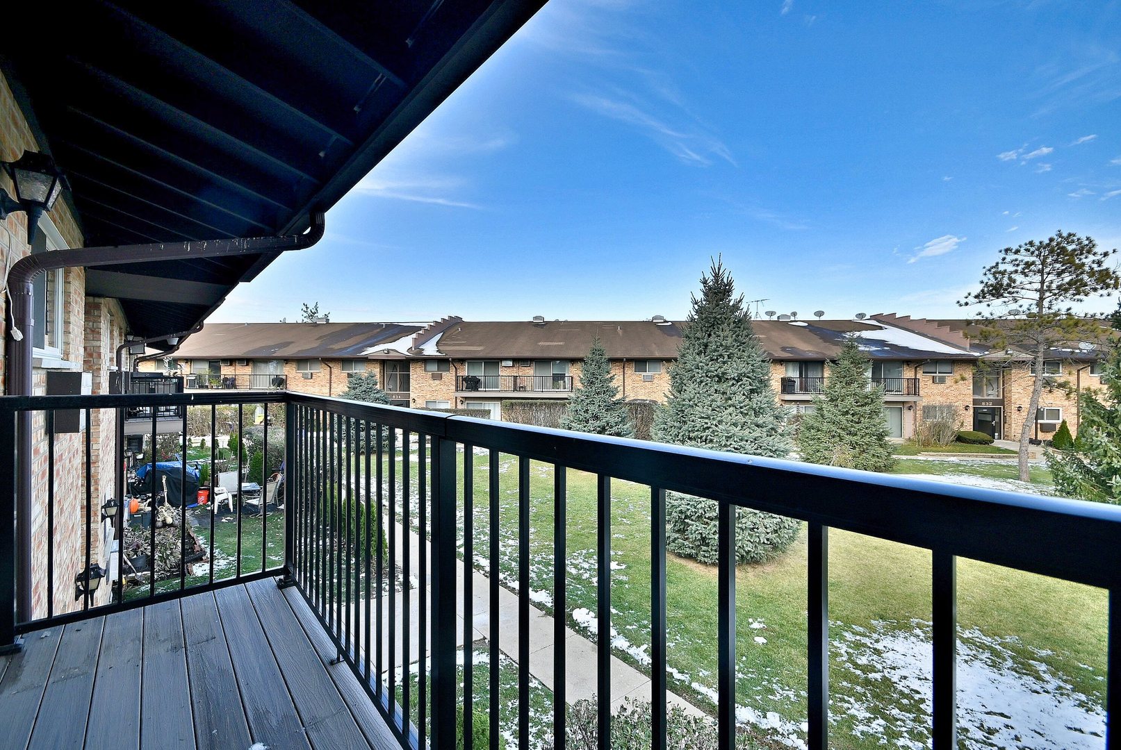836 East Old Willow Road, Unit 211 Prospect Heights, IL 60070 - Photo 21 of 28 a view of a balcony with furniture and wooden floor
