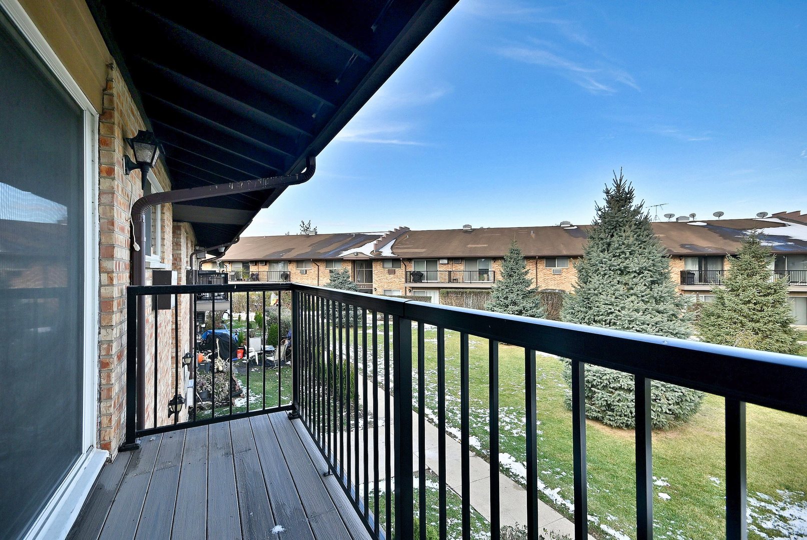 836 East Old Willow Road, Unit 211 Prospect Heights, IL 60070 - Photo 22 of 28 a view of a balcony with wooden floor