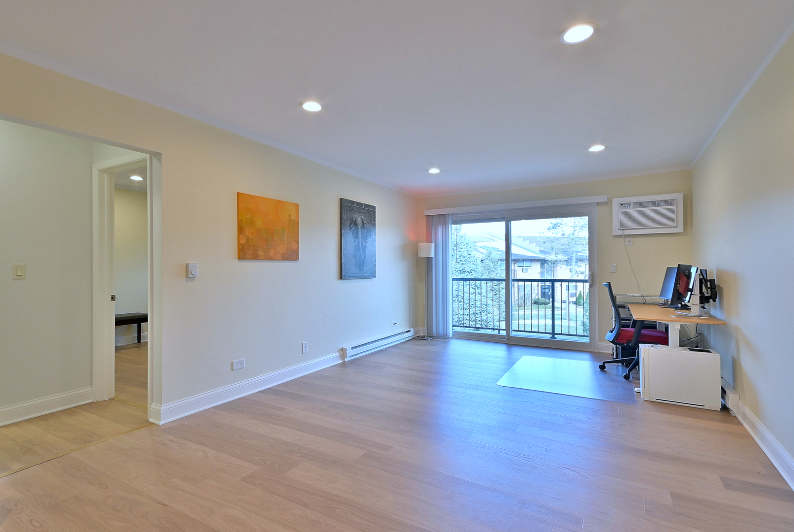 836 East Old Willow Road, Unit 211 Prospect Heights, IL 60070 - Photo 4 of 28 a view of a big room with wooden floor and windows