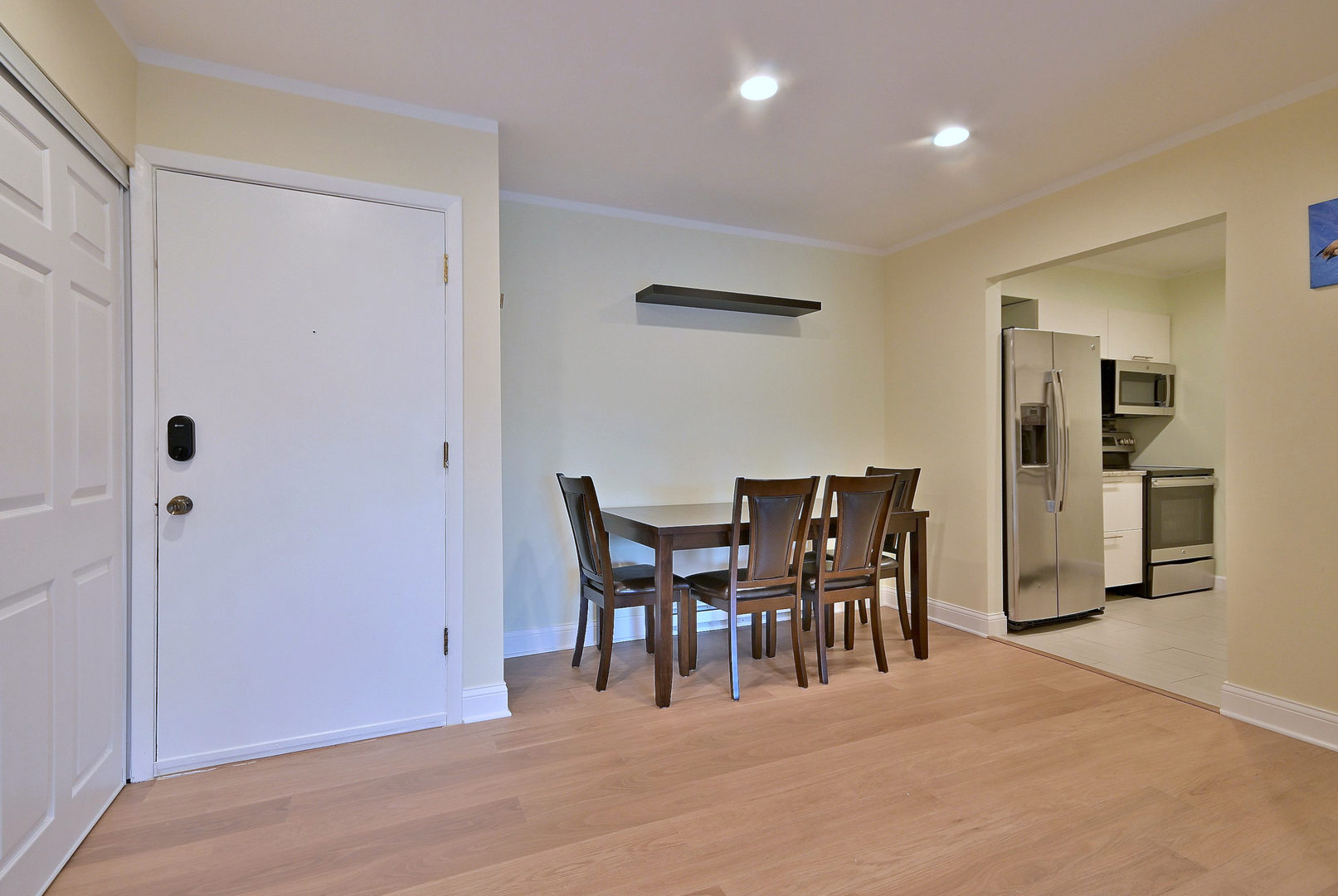836 East Old Willow Road, Unit 211 Prospect Heights, IL 60070 - Photo 5 of 28 a view of a dining room with furniture and chandelier