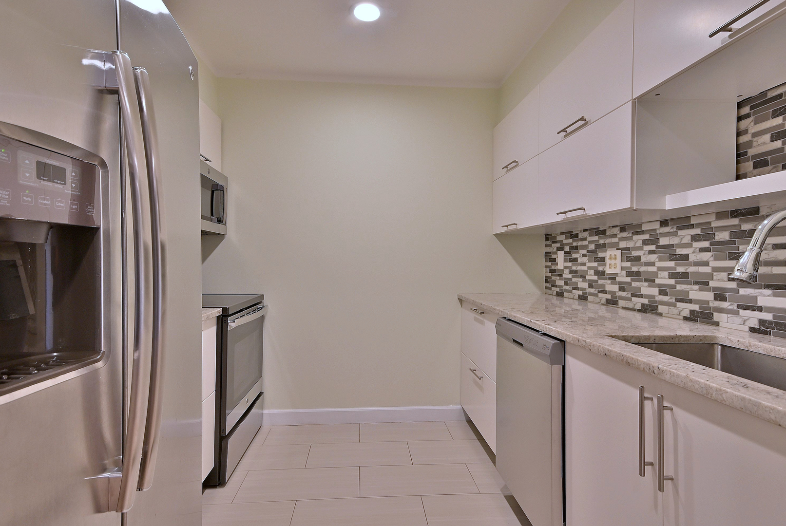836 East Old Willow Road, Unit 211 Prospect Heights, IL 60070 - Photo 7 of 28 a kitchen with stainless steel appliances granite countertop a refrigerator and a sink