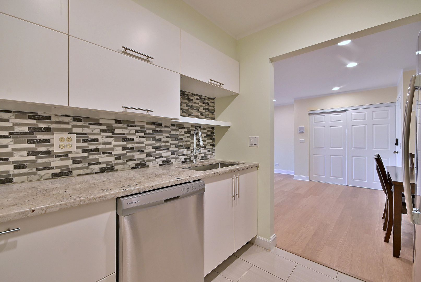836 East Old Willow Road, Unit 211 Prospect Heights, IL 60070 - Photo 9 of 28 a kitchen with a sink and cabinets