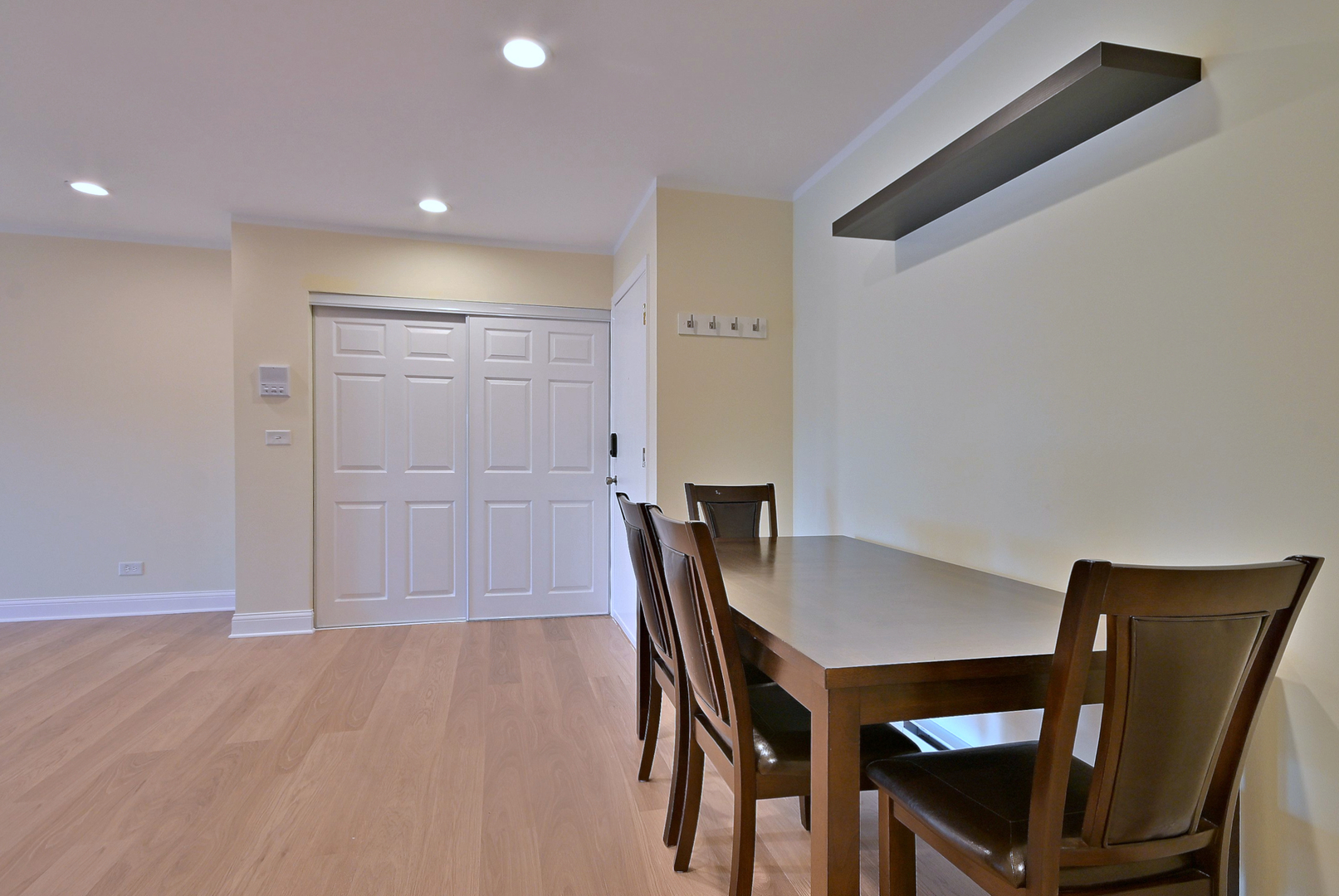 836 East Old Willow Road, Unit 211 Prospect Heights, IL 60070 - Photo 10 of 28 a view of a dining room with furniture and wooden floor