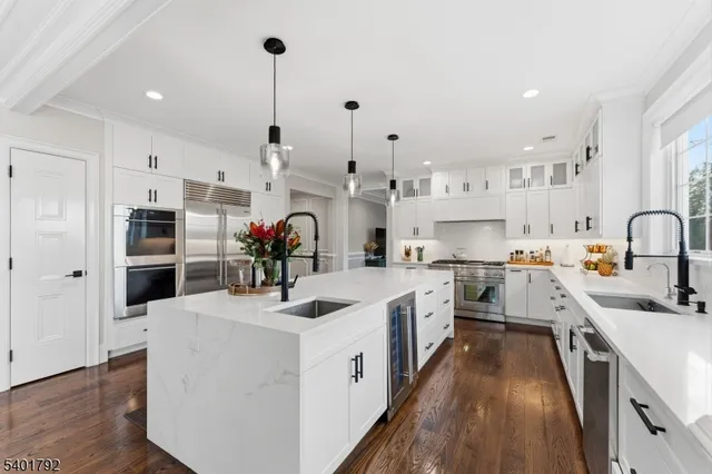 a kitchen with stainless steel appliances sink and cabinets