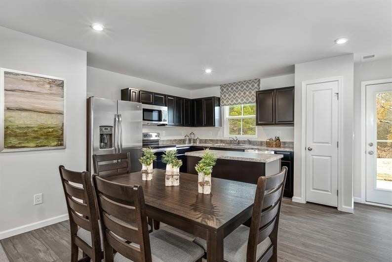632 Merle Avenue Franklin, KY 42134 - Photo 3 of 11 a kitchen with a table and chairs in it