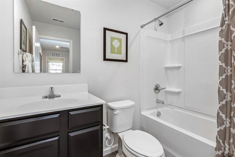 632 Merle Avenue Franklin, KY 42134 - Photo 10 of 11 a bathroom with a sink a toilet and shower