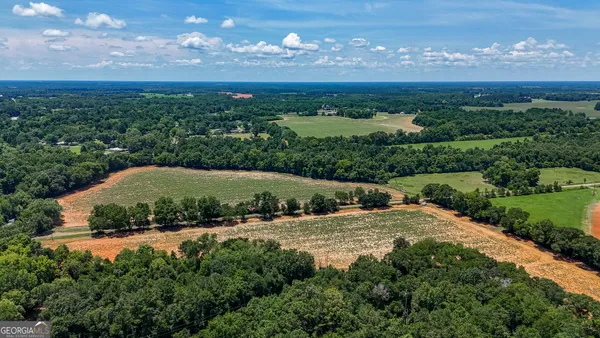aerial view of a house with a yard