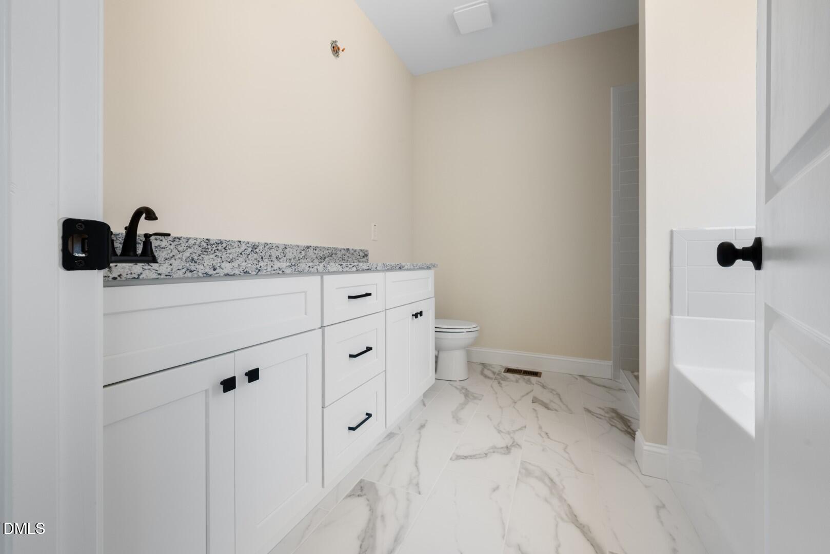 2251 Peachtree Hills Road Spring Hope, NC 27882 - Photo 24 of 46 a bathroom with a sink and mirror