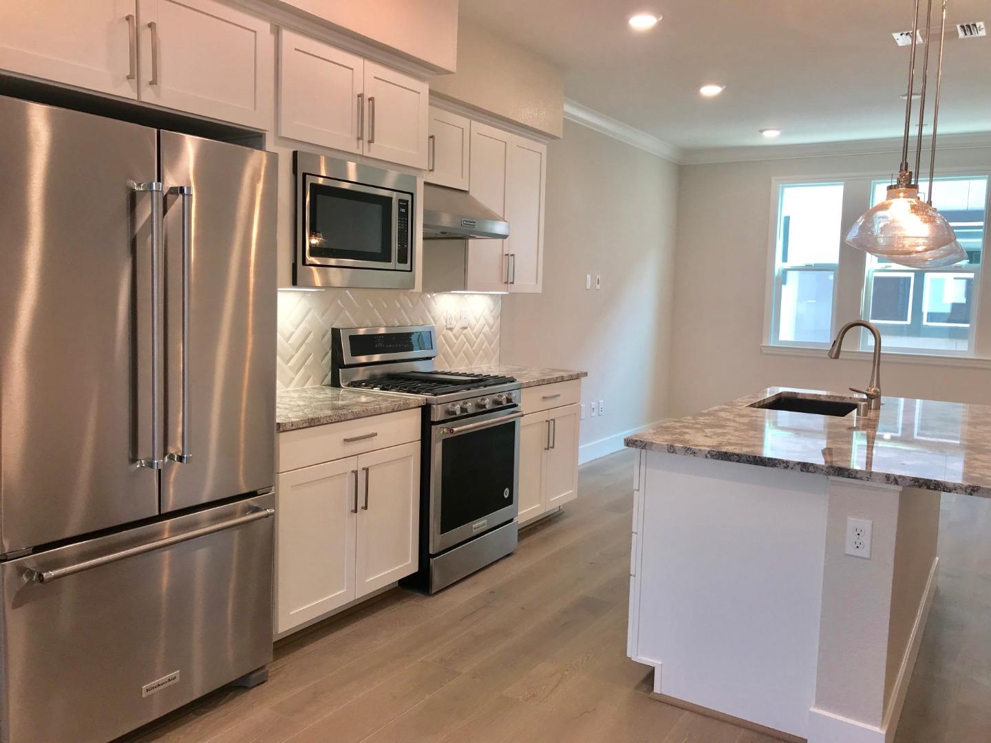 1506 Cherry Circle Milpitas, CA 95035 - Photo 3 of 12 a kitchen with stainless steel appliances a refrigerator stove and microwave