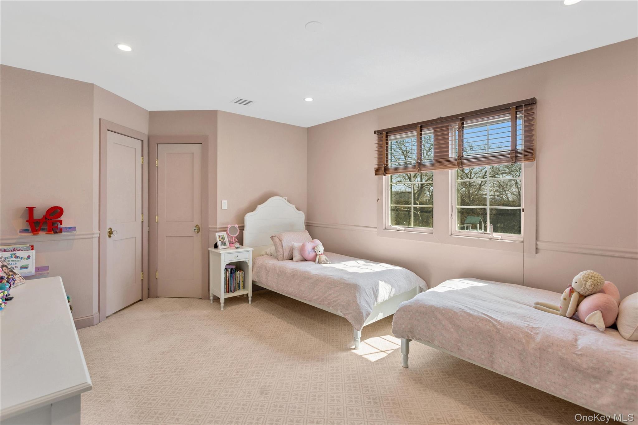 315 Hewlett Neck Road Woodmere, NY 11598 - Photo 20 of 37 a bed room with a bed and a window