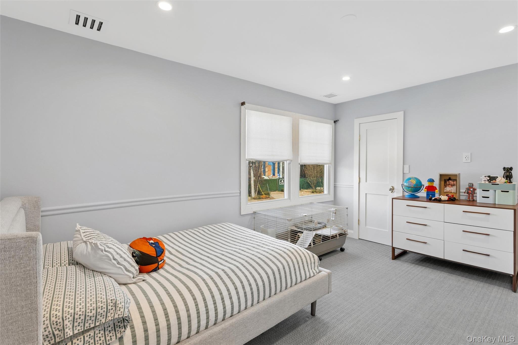 315 Hewlett Neck Road Woodmere, NY 11598 - Photo 22 of 37 a bedroom with bed and a window