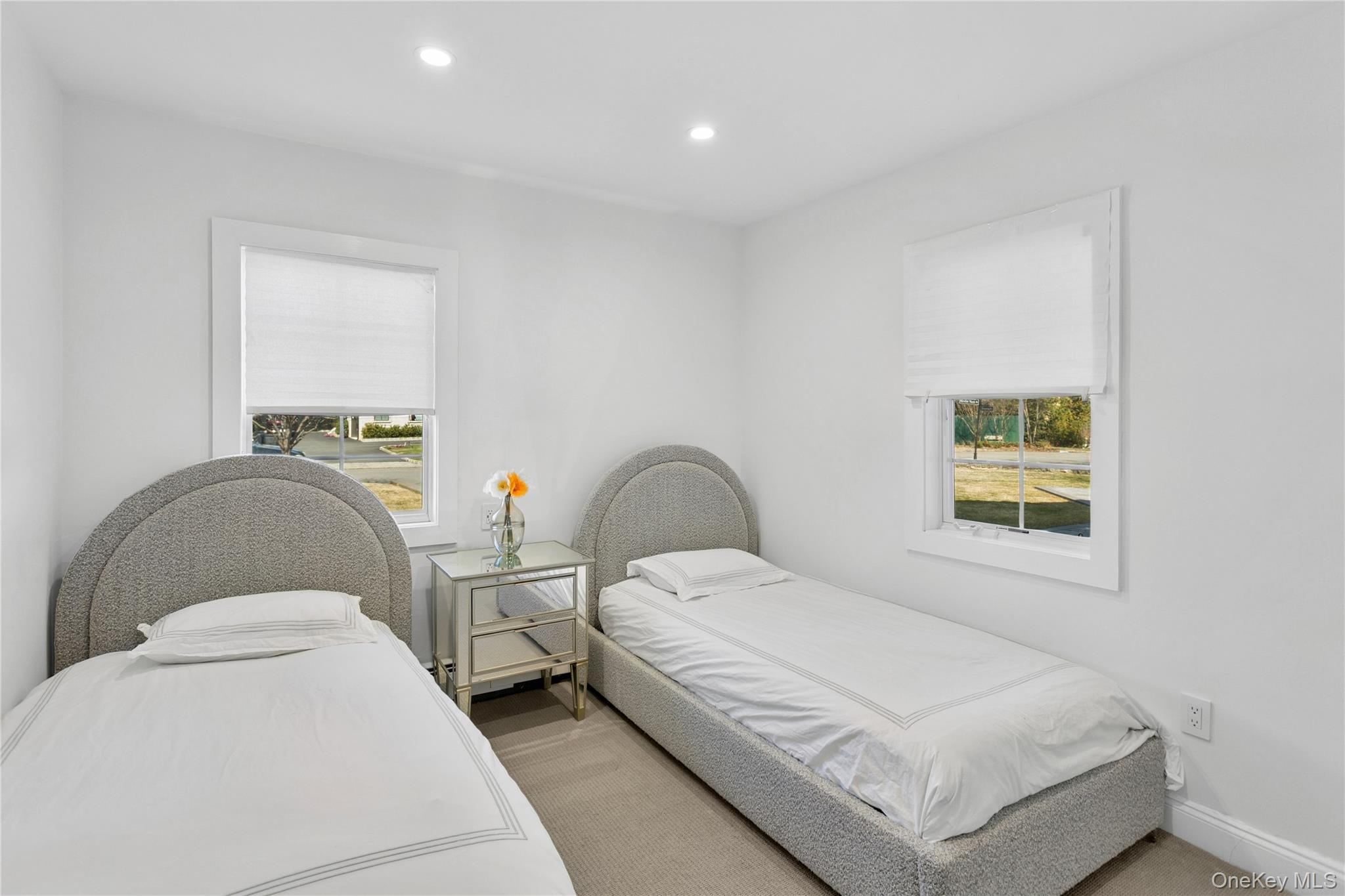 315 Hewlett Neck Road Woodmere, NY 11598 - Photo 23 of 37 a bedroom with two beds and window