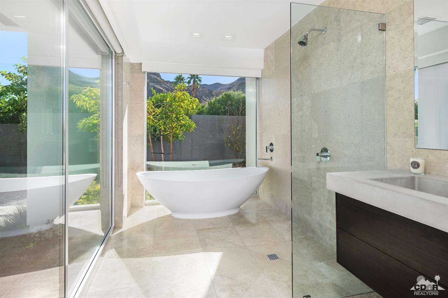 70262 Sonora Road Rancho Mirage, CA 92270 - Photo 20 of 24 a spacious bathroom with a bathtub and sink