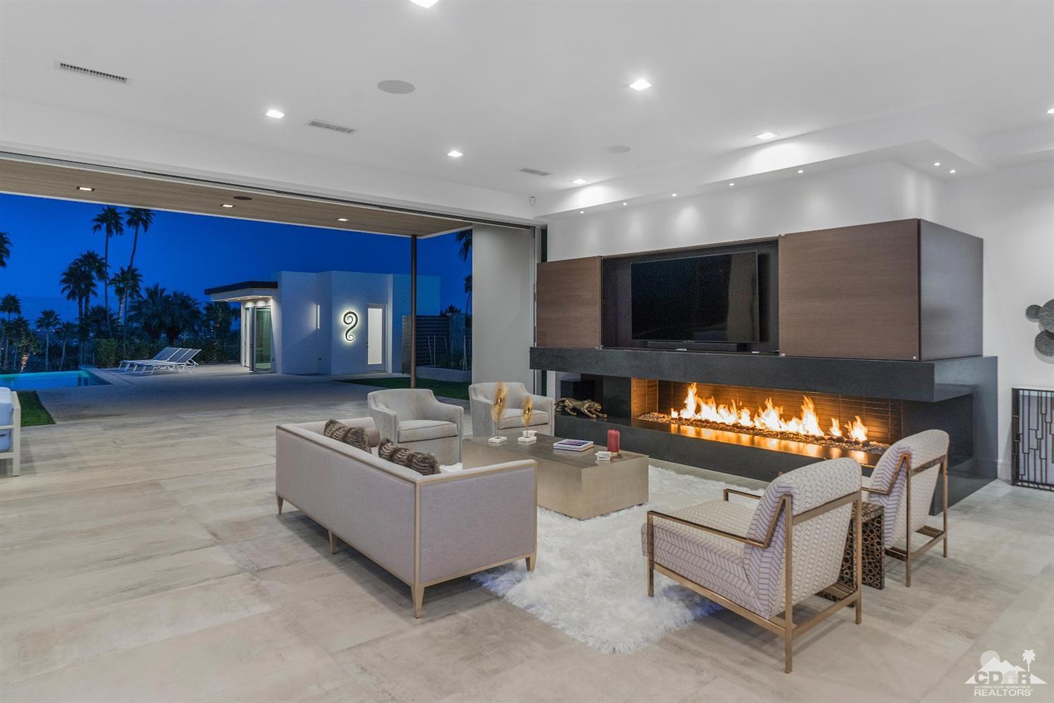 70262 Sonora Road Rancho Mirage, CA 92270 - Photo 7 of 24 a living room with furniture and a flat screen tv