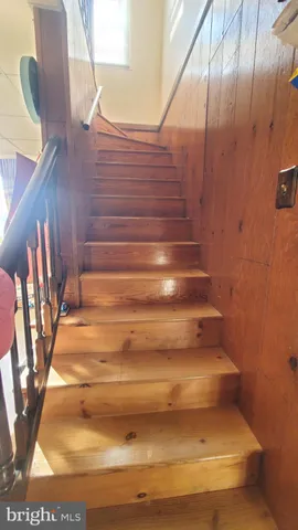 a room with furniture and a wooden floor