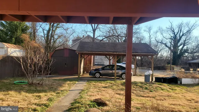 a view of a backyard with a sink and barbeque oven