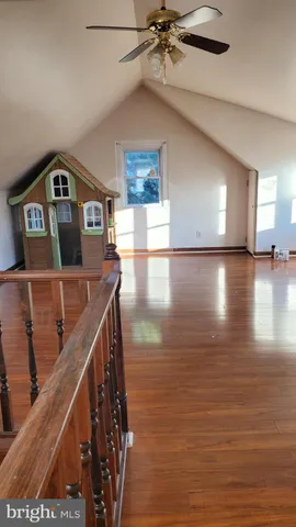 a view of a livingroom with wooden floor