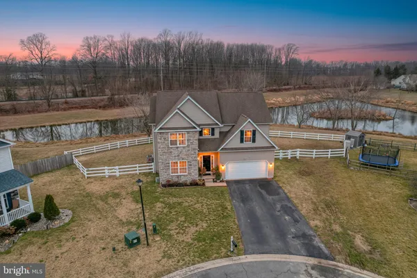 a view of a house with a yard from a balcony