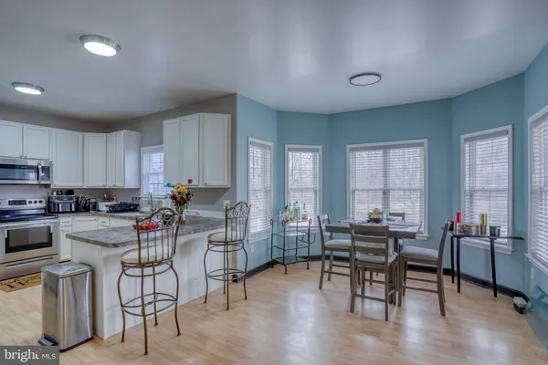 a dining room with furniture and window