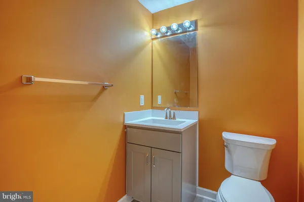 a view of a yard with wooden fence