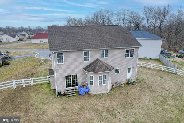 a view of a house with a yard from a balcony