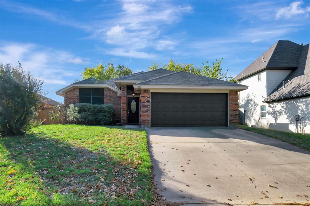 369 Banyan Drive Grapevine, TX 76051 - Photo 1 of 1 a front view of a house with a yard and garage