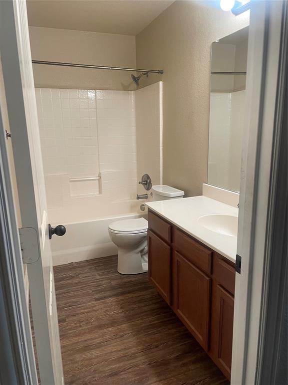 892 West First Street Maypearl, TX 76064 - Photo 11 of 18 a bathroom with a sink a toilet a mirror and shower