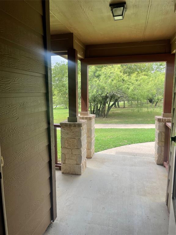 892 West First Street Maypearl, TX 76064 - Photo 5 of 18 a view of a porch with furniture and garden