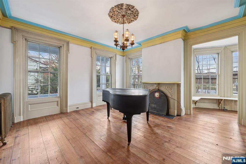 142 Island Road Mahwah, NJ 07430 - Photo 22 of 46 a view of a dining room with furniture a chandelier and wooden floor