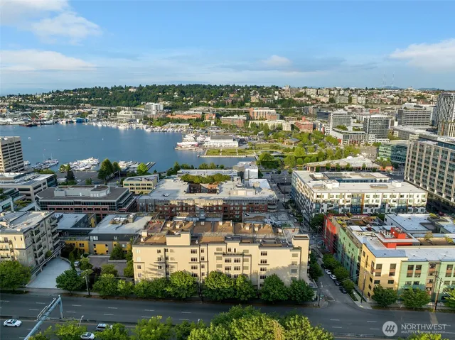 an aerial view of a city with ocean view
