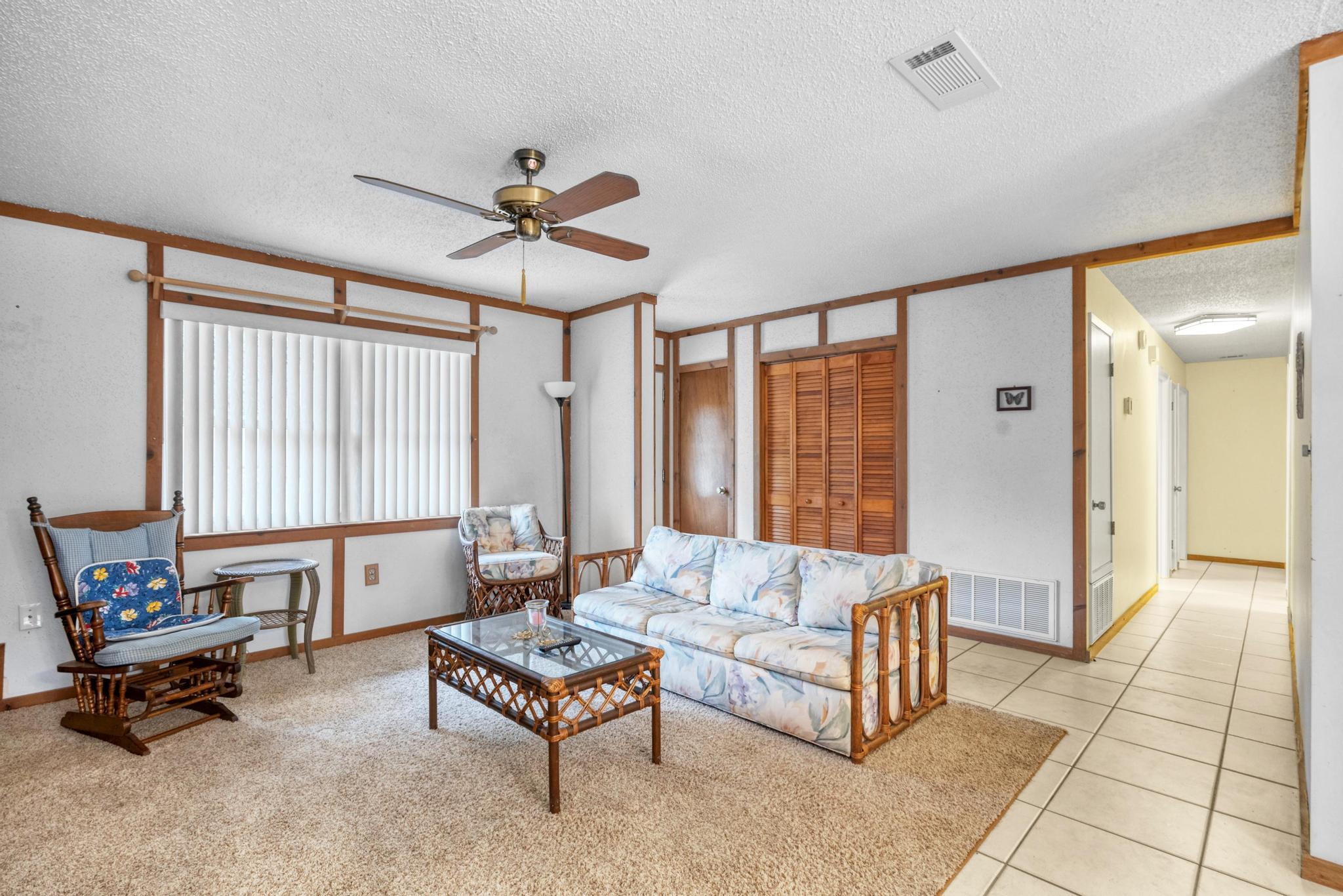 6079 Clear Creek Road Crestview, FL 32539 - Photo 8 of 58 a living room with furniture and a large window