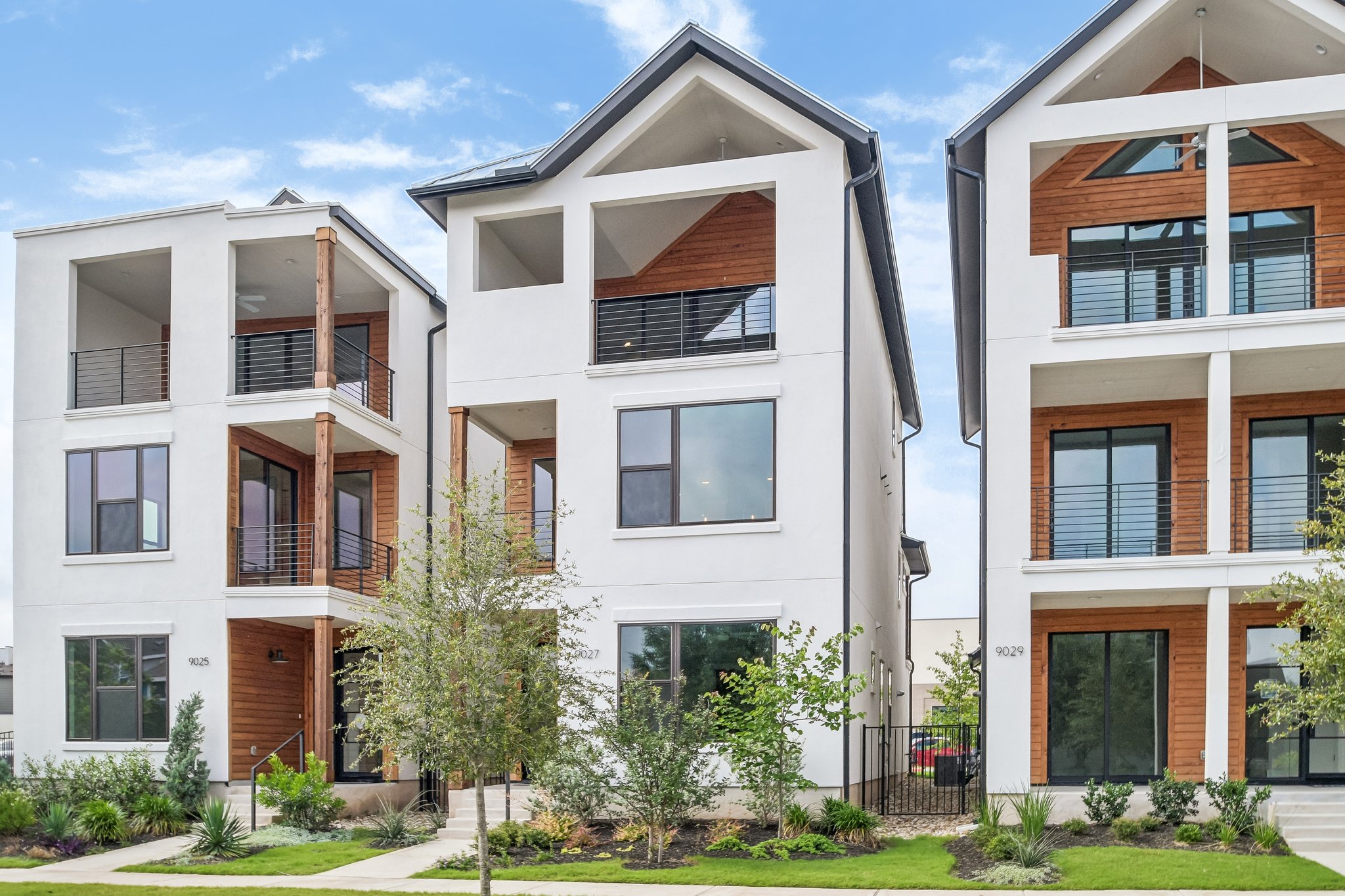 9027 Cattle Baron Path Austin, TX 78747 - Photo 3 of 32 Clean lines and modern architectural design define these three-story townhomes.