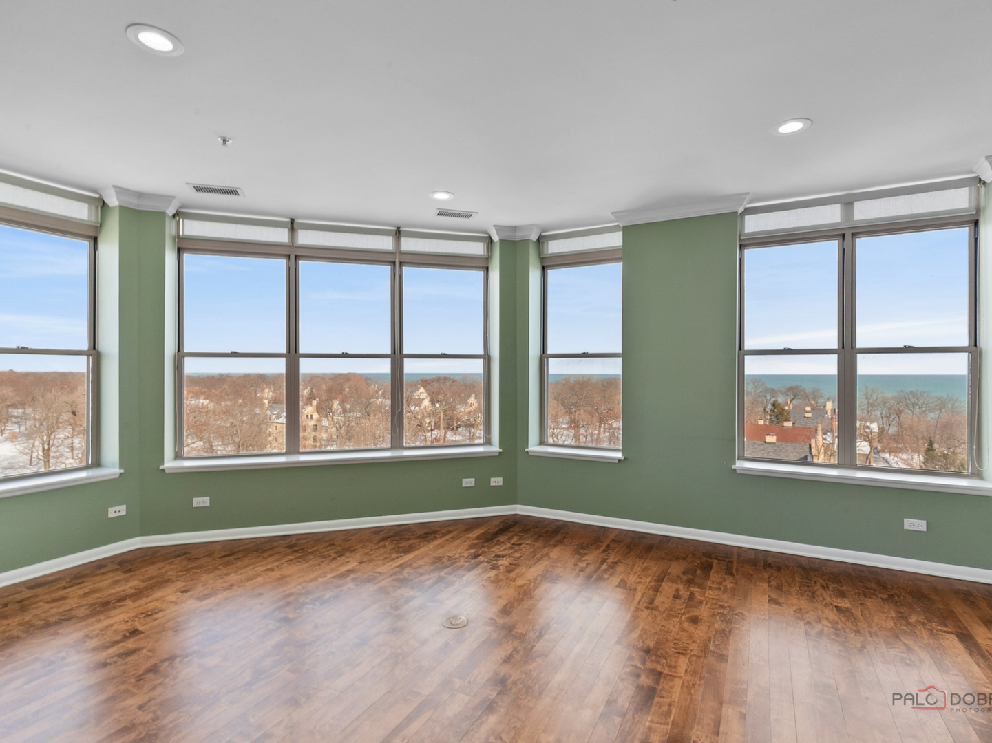 3535 Patten Road, Unit 6E Highland Park, IL 60035 - Photo 18 of 47 a view of an empty room with a window and wooden floor