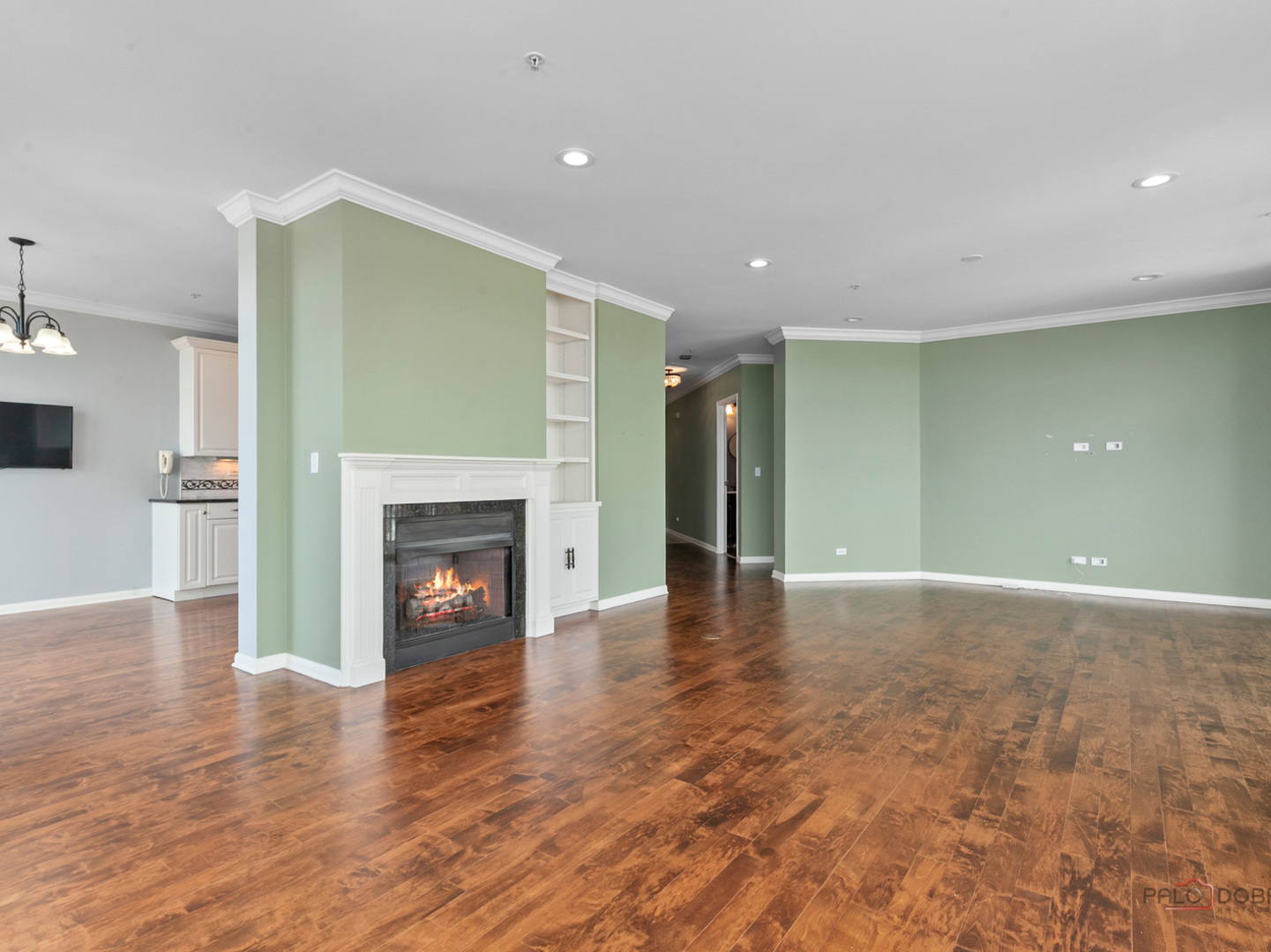 3535 Patten Road, Unit 6E Highland Park, IL 60035 - Photo 26 of 47 a view of empty room with wooden floor and fireplace
