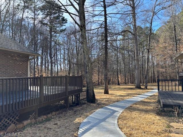 269 Farmland Road Mocksville, NC 27028 - Photo 5 of 33 Very long sidewalk to the backyard needs a gardeners vision!