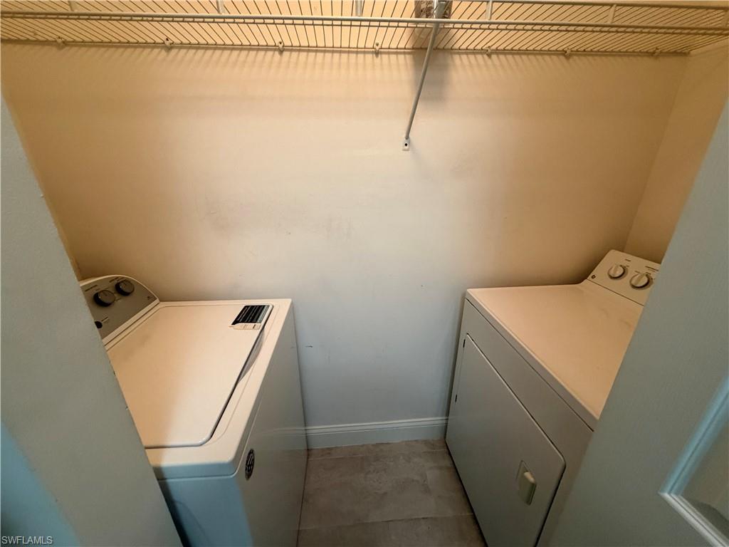 1210 Reserve Way, Unit 9107 Naples, FL 34105 - Photo 15 of 22 a utility room with dryer and washer