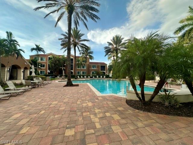 1210 Reserve Way, Unit 9107 Naples, FL 34105 - Photo 19 of 22 a view of outdoor space with swimming pool