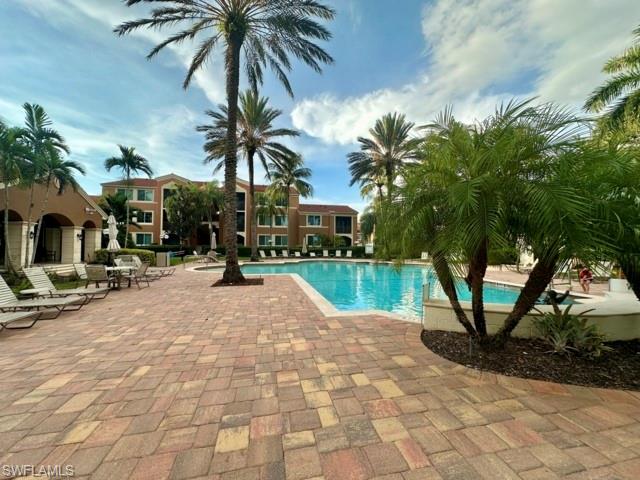 1210 Reserve Way, Unit 9107 Naples, FL 34105 - Photo 20 of 22 a view of outdoor space yard and porch