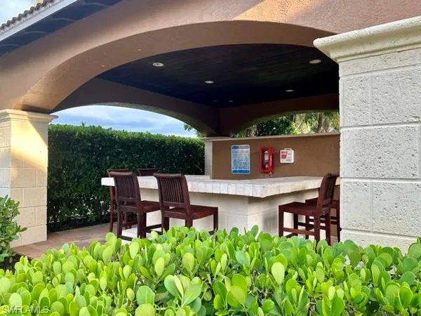 a view of a chairs and table in a patio