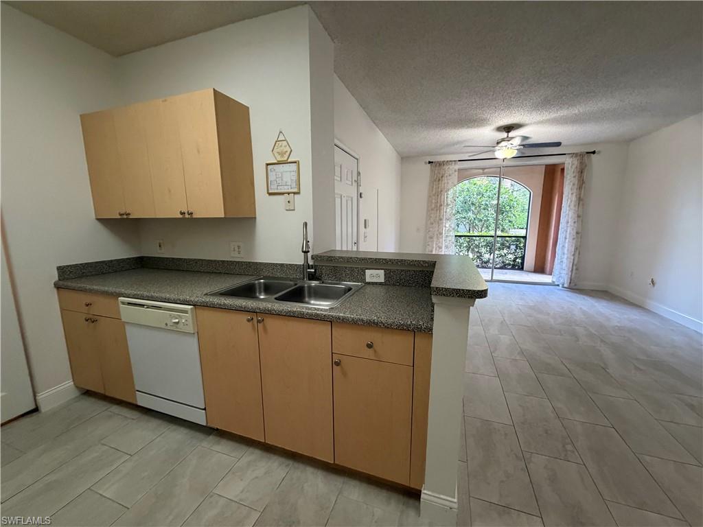 1210 Reserve Way, Unit 9107 Naples, FL 34105 - Photo 9 of 22 a bathroom with a sink and a mirror