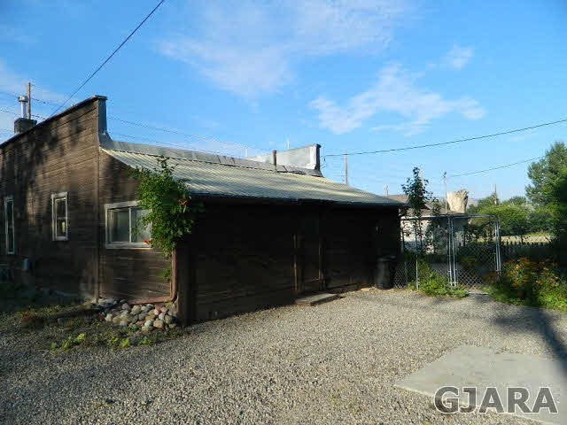 2398 H Road Grand Junction, CO 81505 - Photo 2 of 7 a front view of a house with a yard
