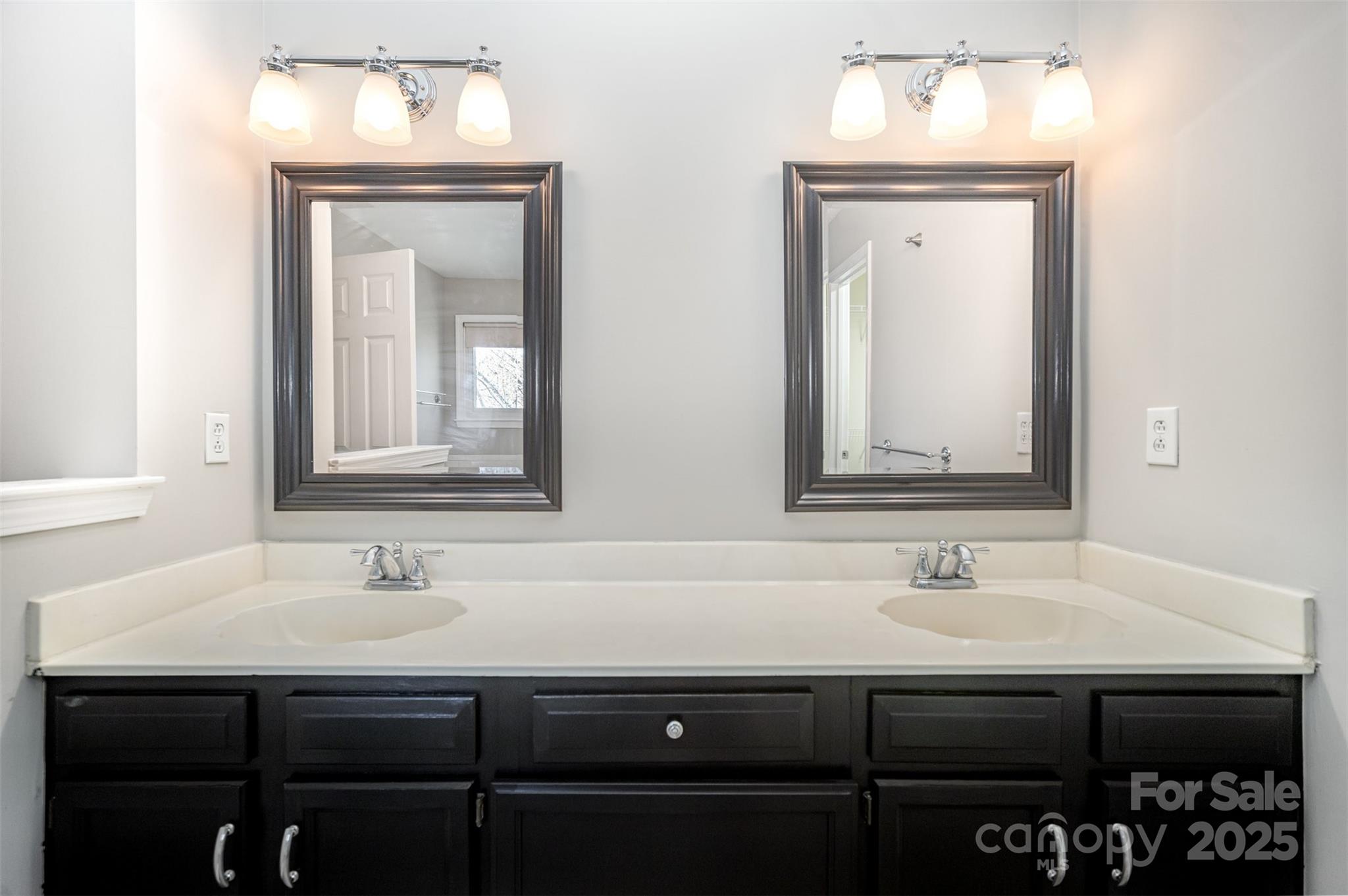 2507 Bathgate Lane Matthews, NC 28105 - Photo 9 of 36 a bathroom with a sink and a mirror