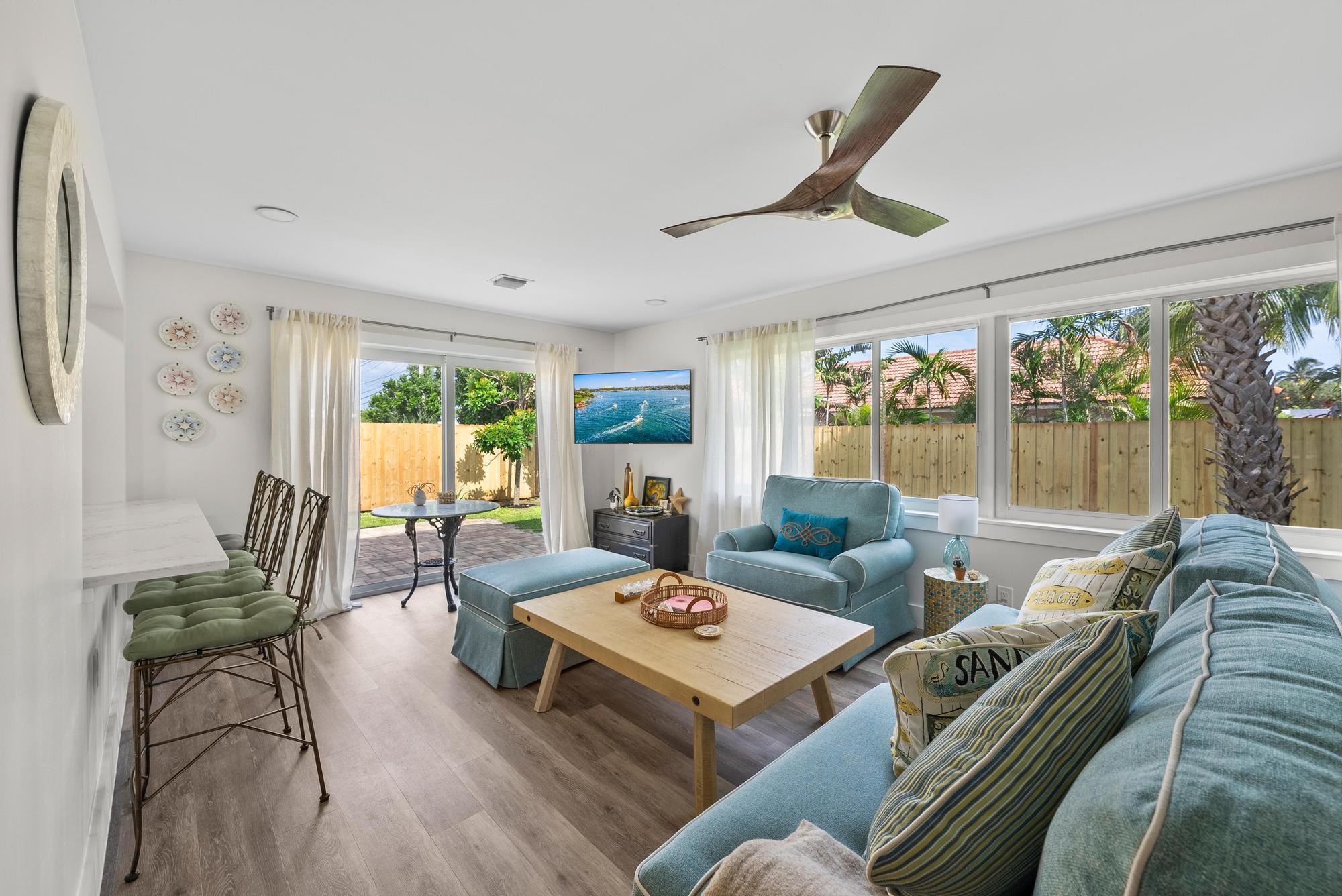 517 Gulf Road North Palm Beach, FL 33408 - Photo 19 of 59 a living room with furniture and a large window