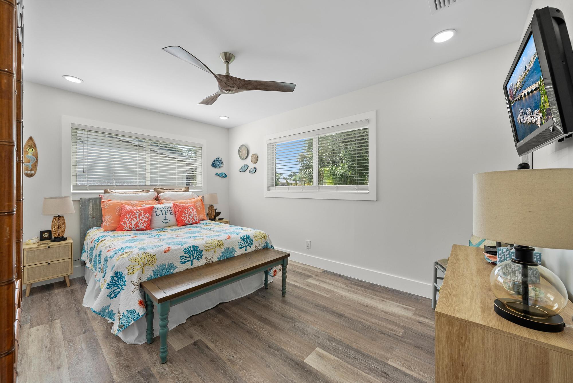 517 Gulf Road North Palm Beach, FL 33408 - Photo 24 of 59 a bedroom with a bed and a flat screen tv