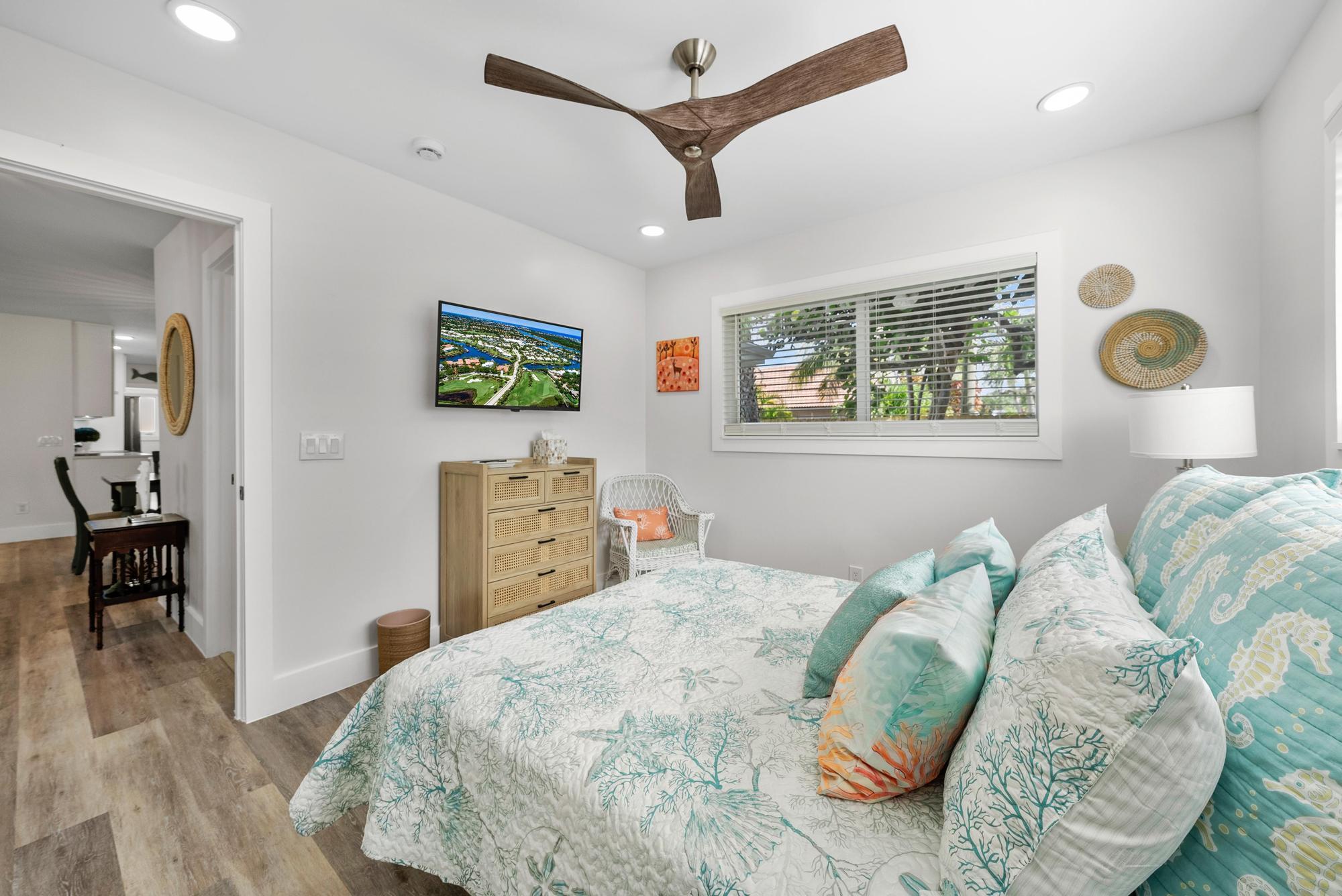 517 Gulf Road North Palm Beach, FL 33408 - Photo 27 of 59 a bedroom with a bed and a window