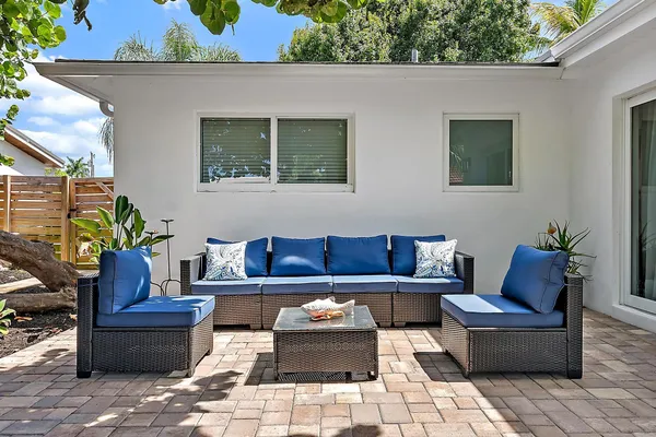 a view of backyard with outdoor seating