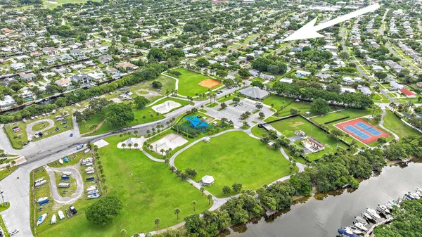 an aerial view of a pool yard swimming pool and outdoor seating
