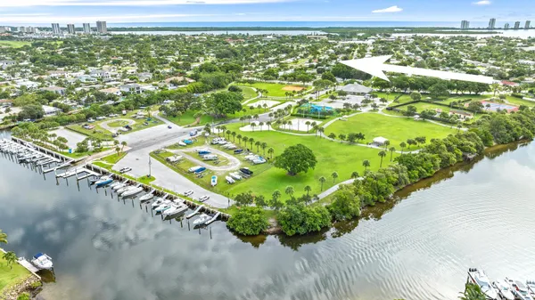 an aerial view of a residential houses with outdoor space and street view