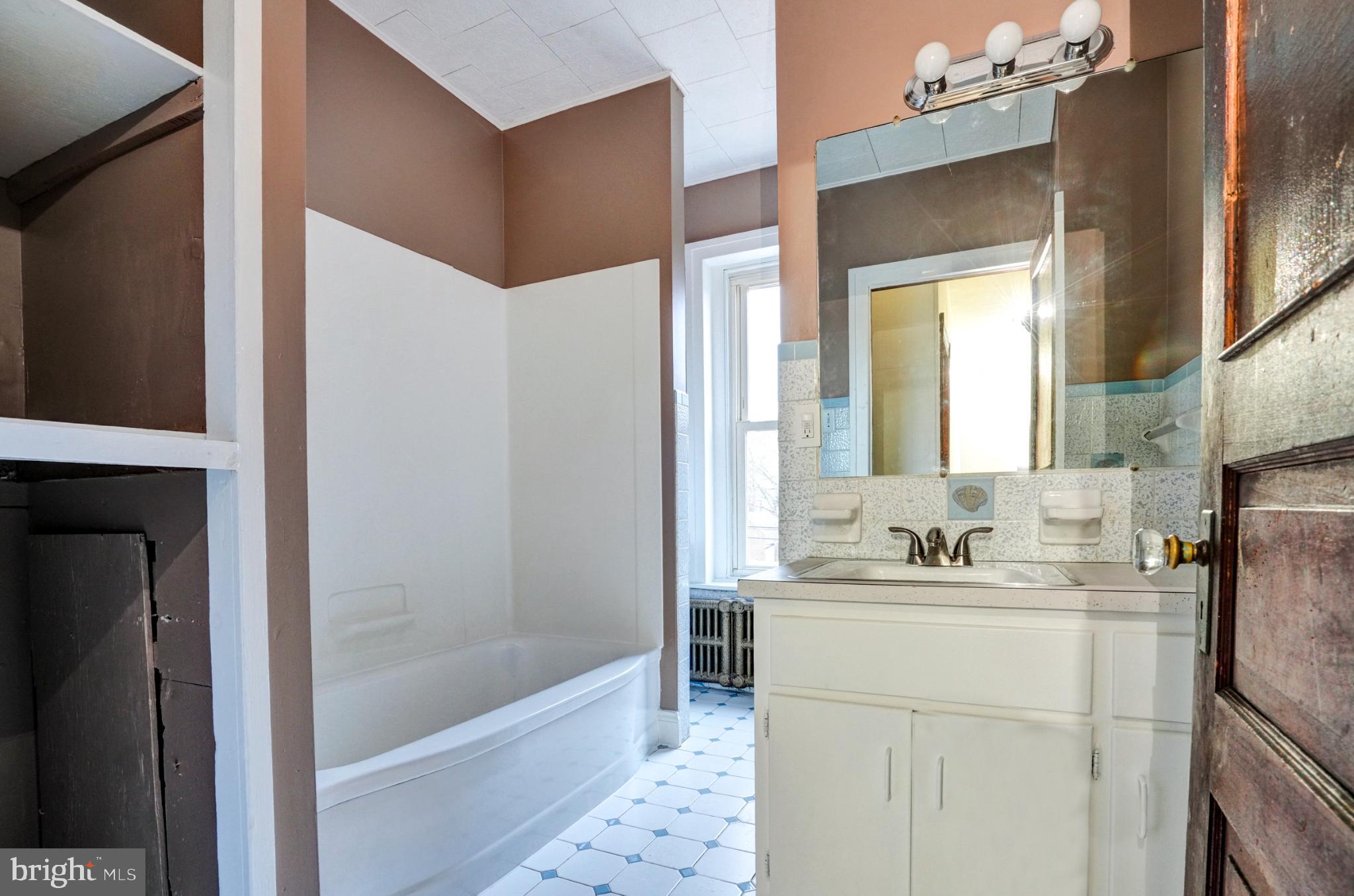 642 Walnut Street Pottstown, PA 19464 - Photo 16 of 23 Charming bathroom with vintage tile accents.
